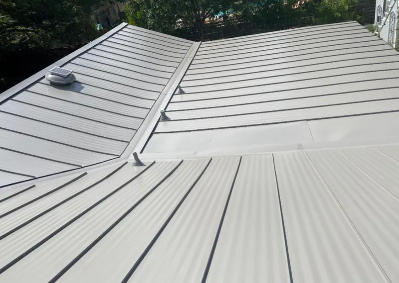 Solar attic fan installed on a metal roof for Roof Ventilation in Mount Holly